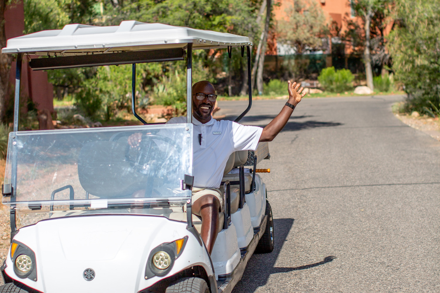 golf cart, employee waving